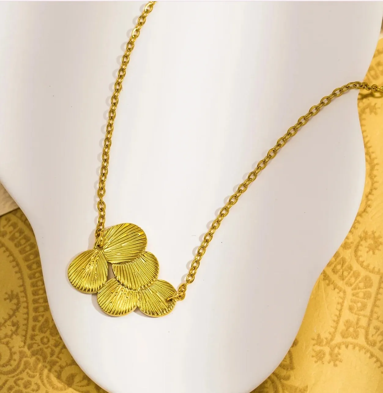 Gold plated brass flower necklace with bright floral pendant on adjustable clavicle chain