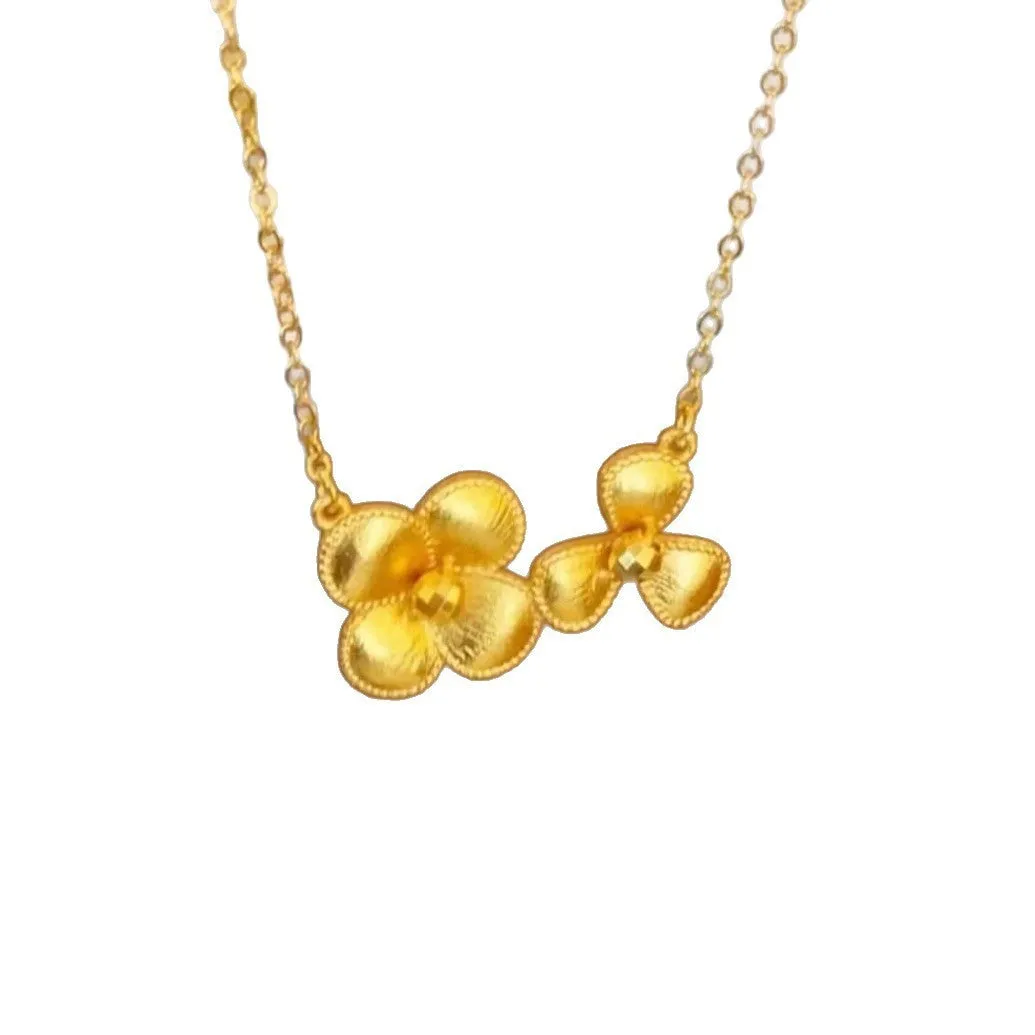 Gold plated brass flower necklace with bright floral pendant on adjustable clavicle chain