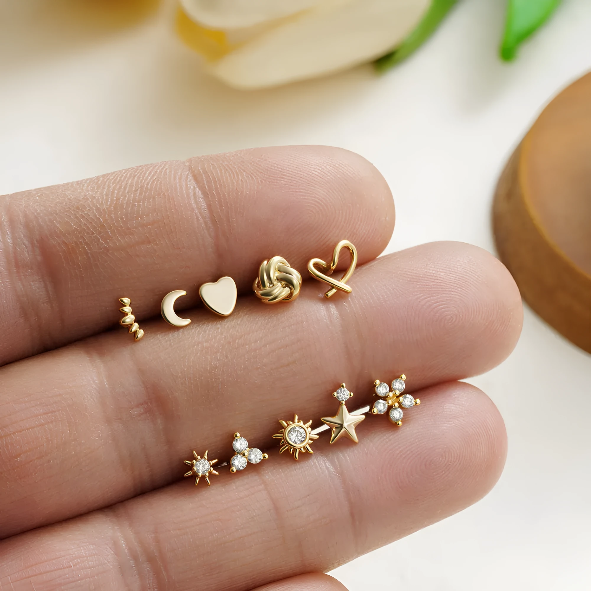 Titanium steel mini ear bone stud with electroplated gold finish and zircon crystal accent in geometric shape