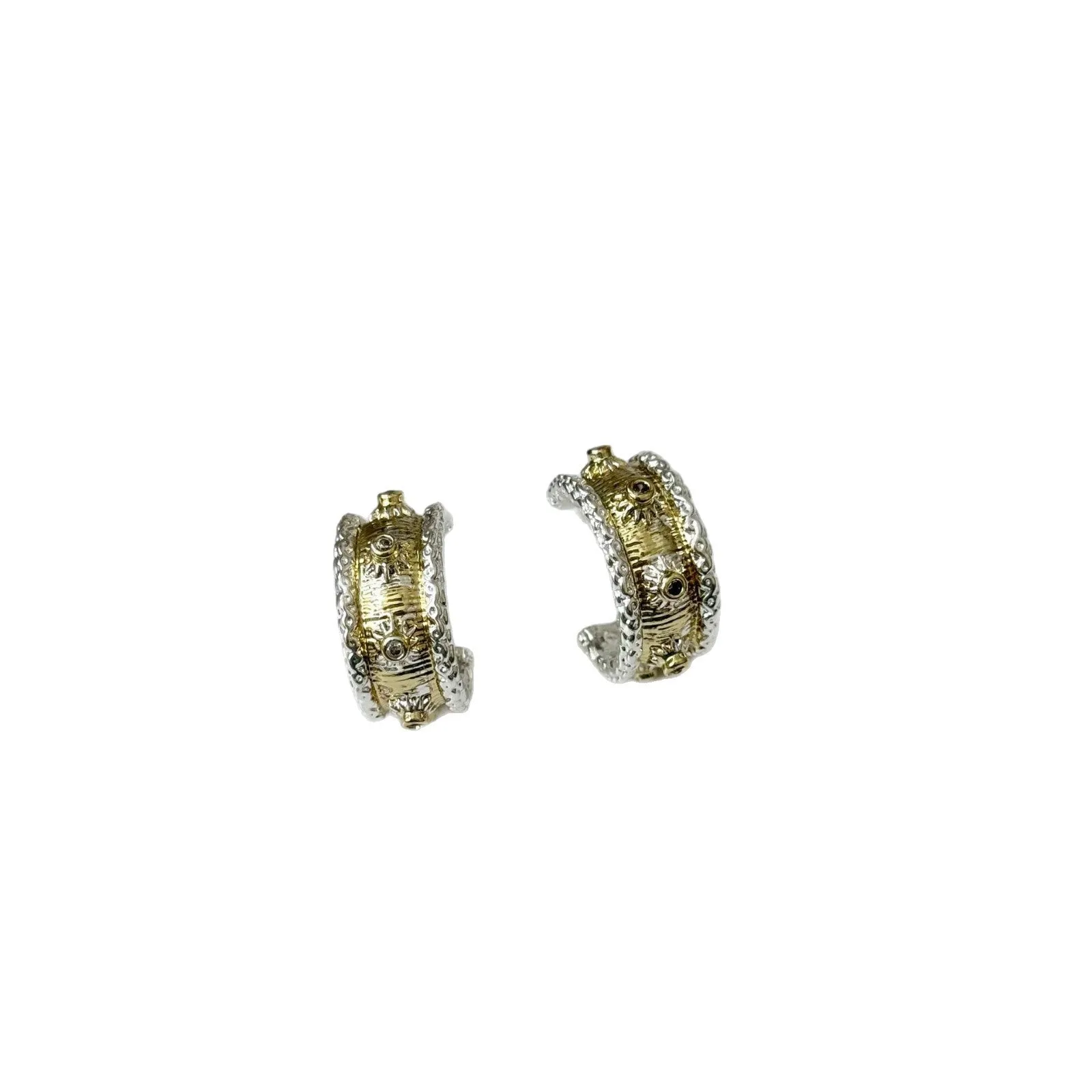 Gold and silver C-shaped brushed ring earrings on display, copper with 925 silver needles