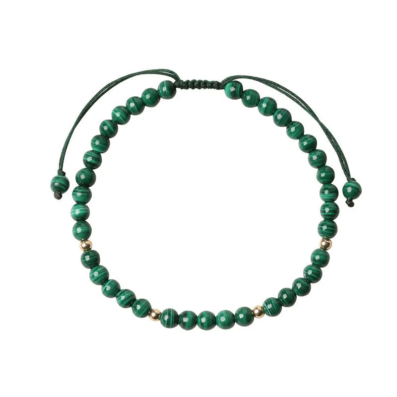 Green malachite stone bracelet with golden beads on woven strap, zodiac animal motif.