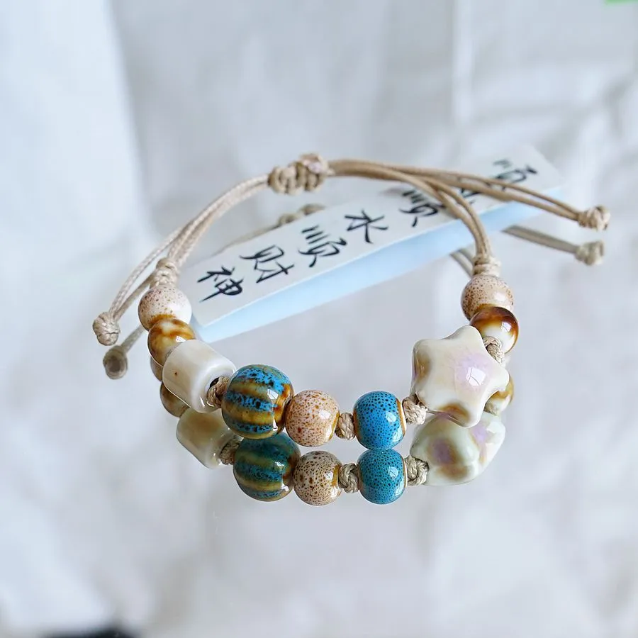 Women's ceramic braided bracelet with hand-woven cord and ceramic beads in traditional Chinese pattern