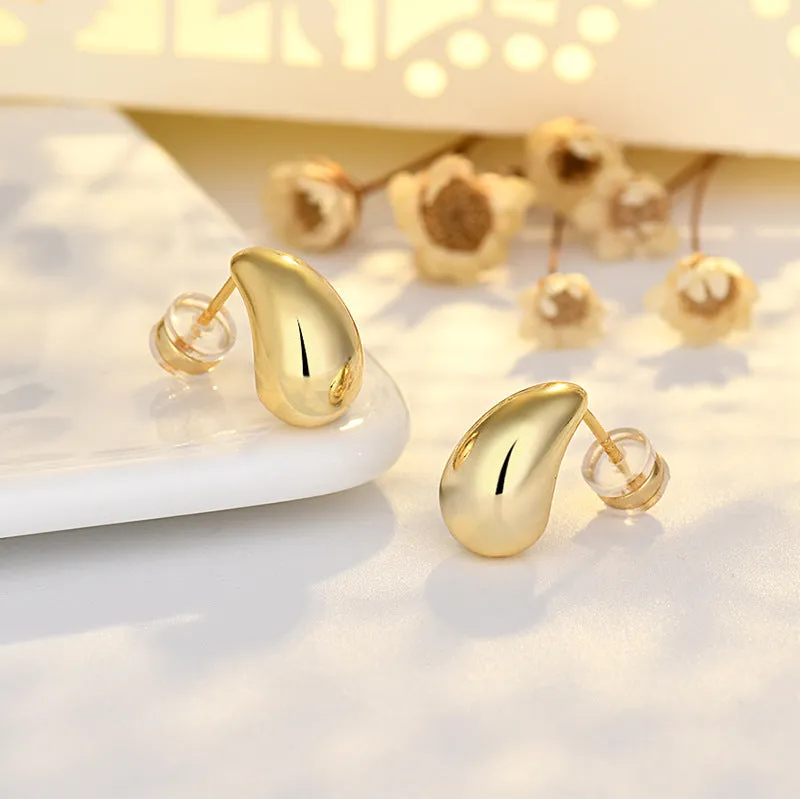 Minimalistic water drop earrings real gold plated copper yellow gold finish on model