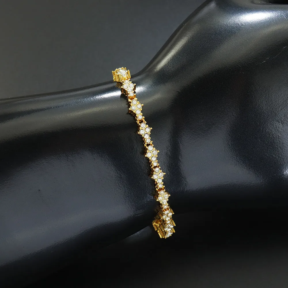 Flower-shaped cross tennis chain bracelet in gold alloy with diamond geometry pattern close-up