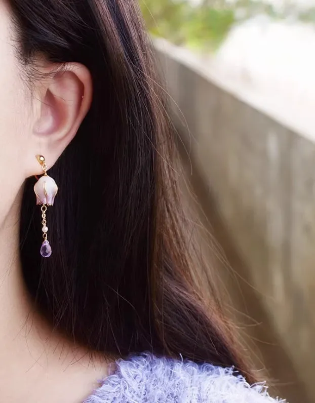 Silver plated gradient colour amethyst water drop tassel ear studs with flower core pattern on white background