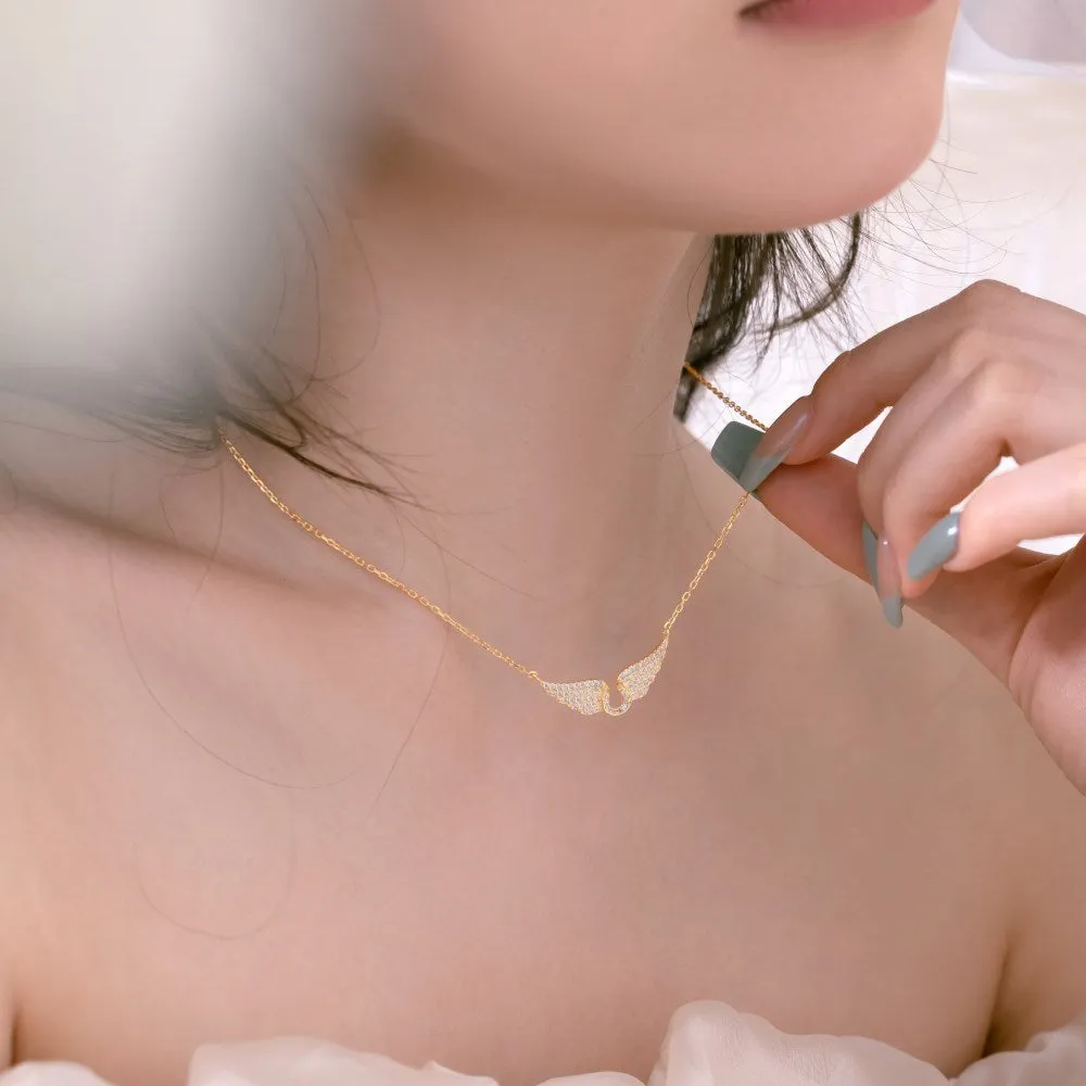925 sterling silver wings fashion necklace on display with electroplated finish in white or yellow gold tone