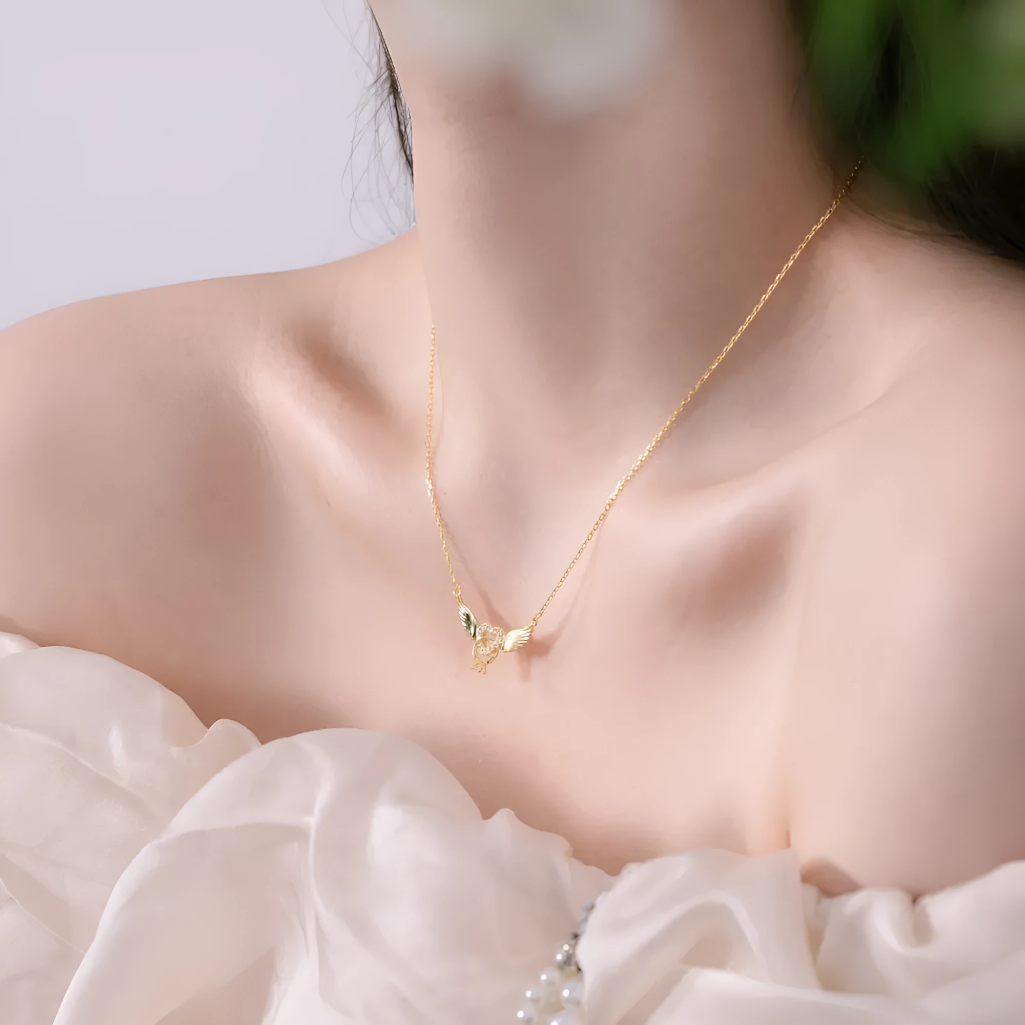 Heart-shaped zircon pendant necklace in 925 sterling silver with wings motif, electroplated finish
