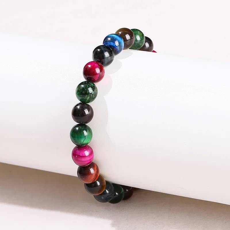 Colourful Tigereye stone bracelet with round beads on a mixed string, showing natural stone variations.