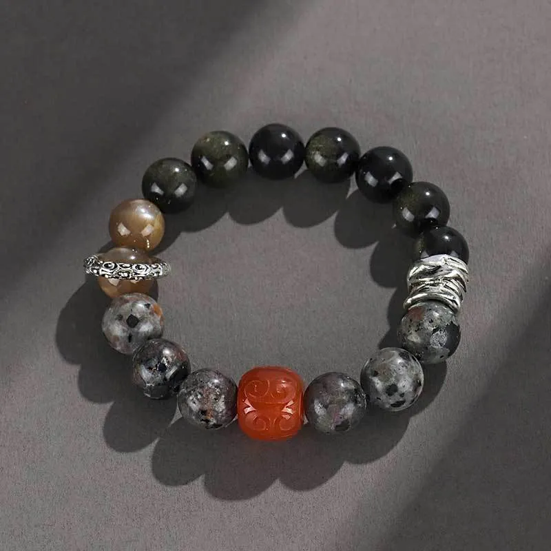 Handcrafted gold obsidian and red agate stone bracelet with Wukong pattern design