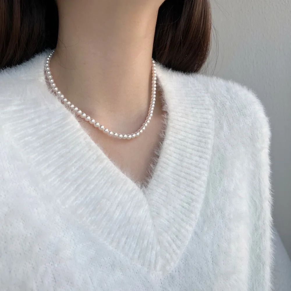 Women's sterling silver necklace with a pearl pendant on silver chain