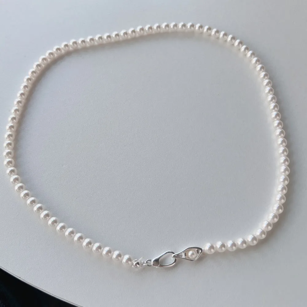 Women's sterling silver necklace with a pearl pendant on silver chain