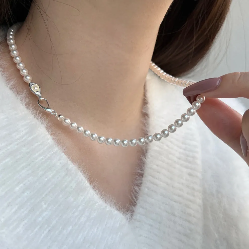 Women's sterling silver necklace with a pearl pendant on silver chain