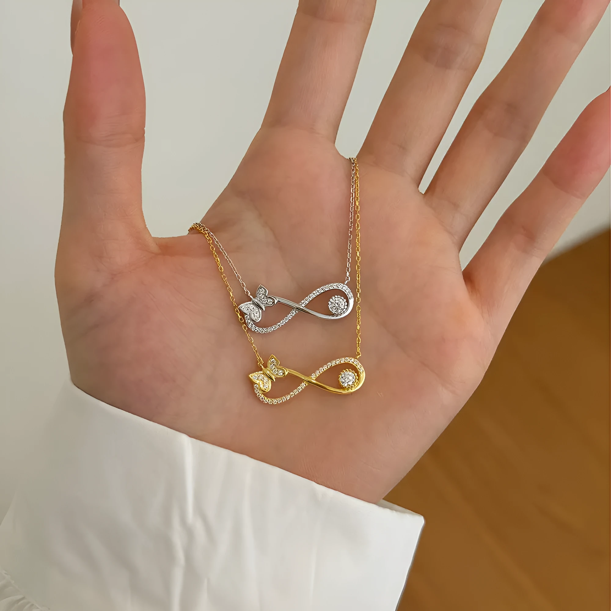 925 silver clavicle chain with mobius bow butterfly pendant set with zircon stones, platinum electroplated finish