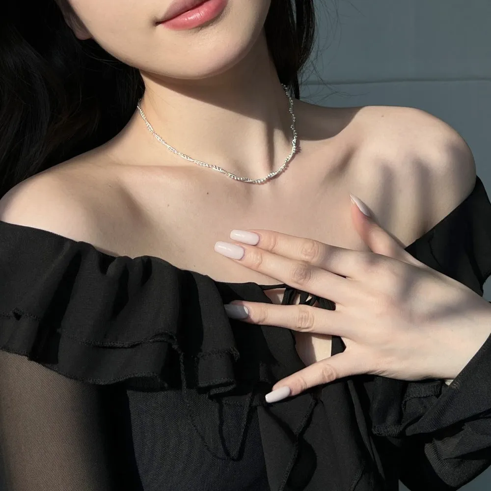 925 sterling silver geometric pendant necklace with electroplated silver finish on woman