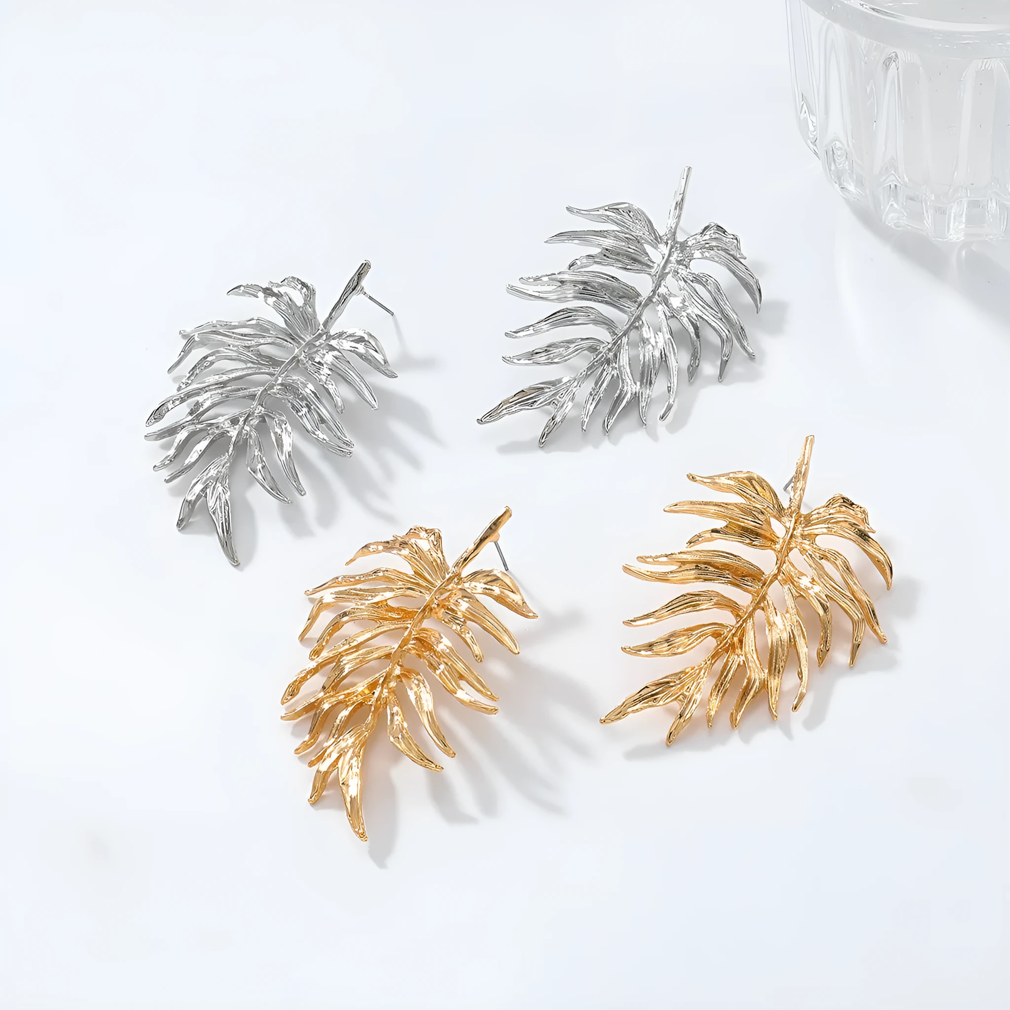 Gold and silver leaf-shaped geometric earrings for women made from zinc alloy affordable luxury style