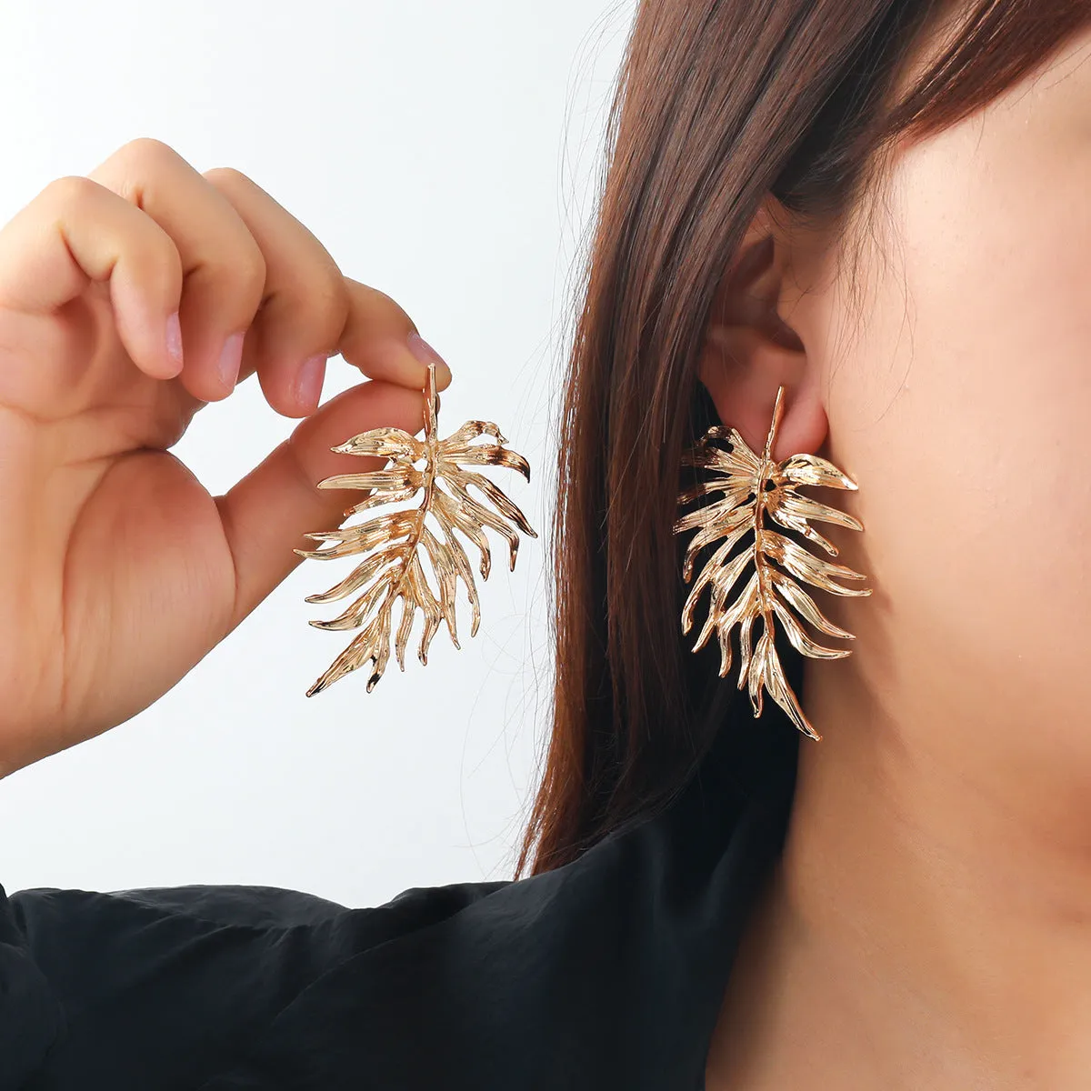 Gold and silver leaf-shaped geometric earrings for women made from zinc alloy affordable luxury style