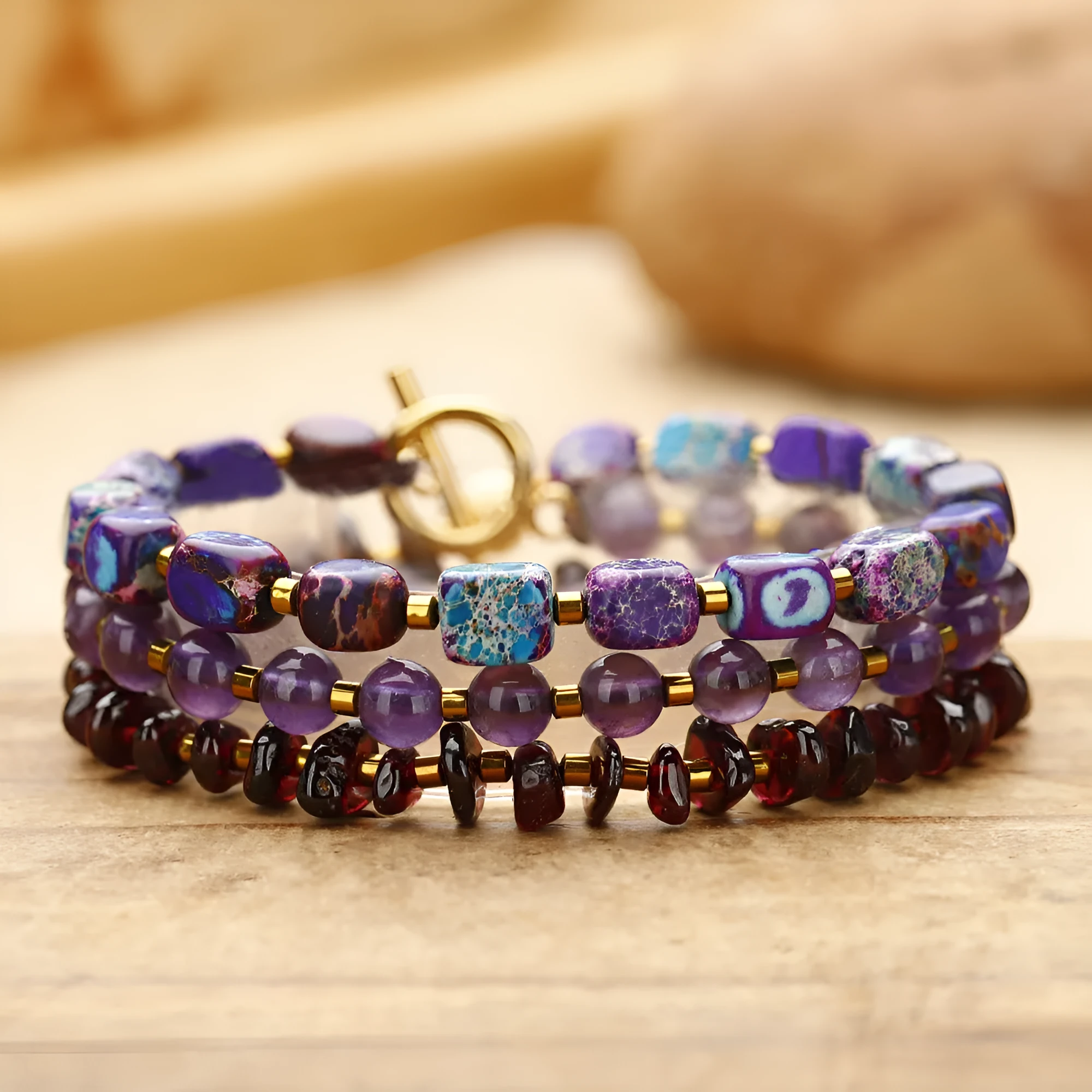 Purple amethyst and garnet round stone bead bracelet with geometric shapes