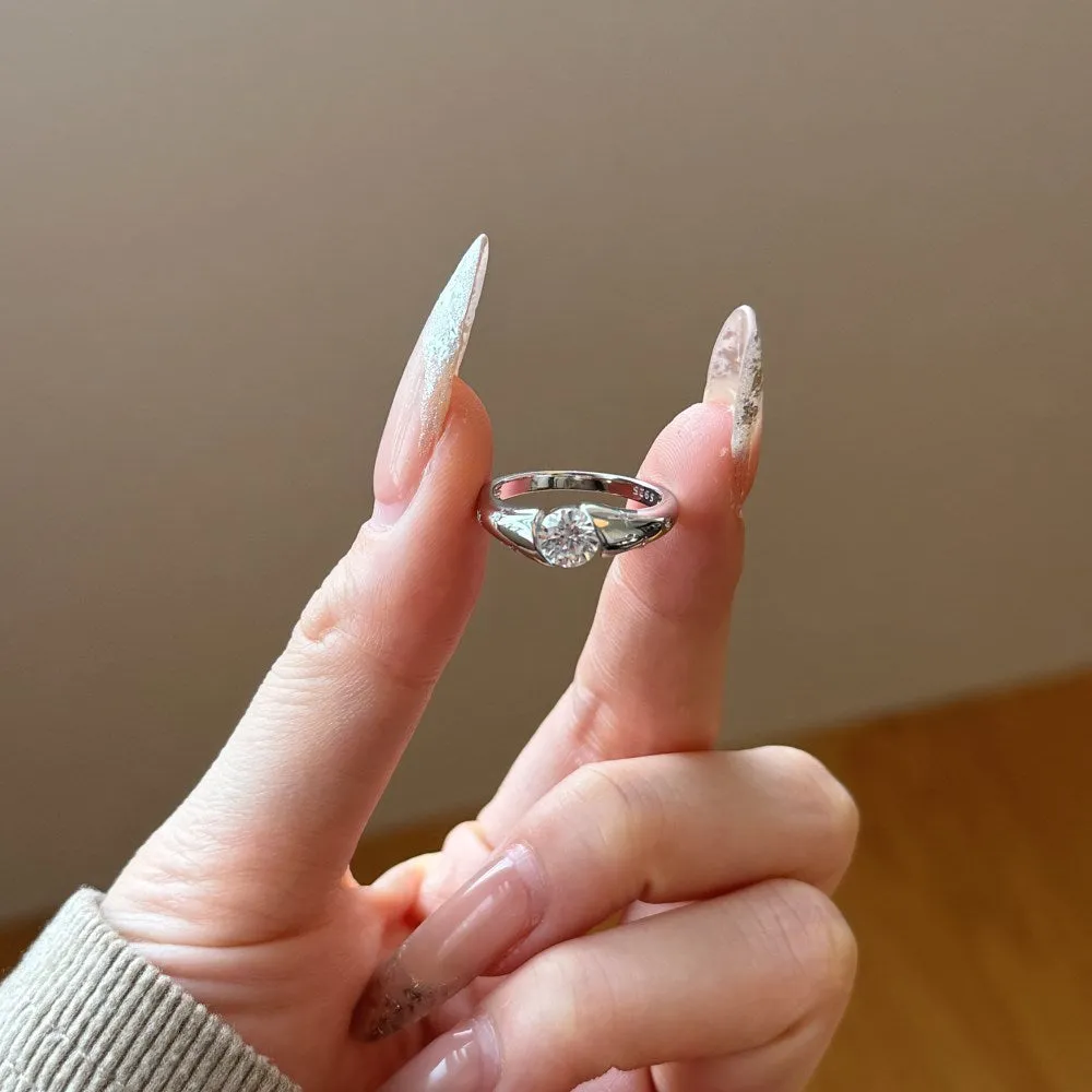 Silver round ring with glossy electroplated finish on display