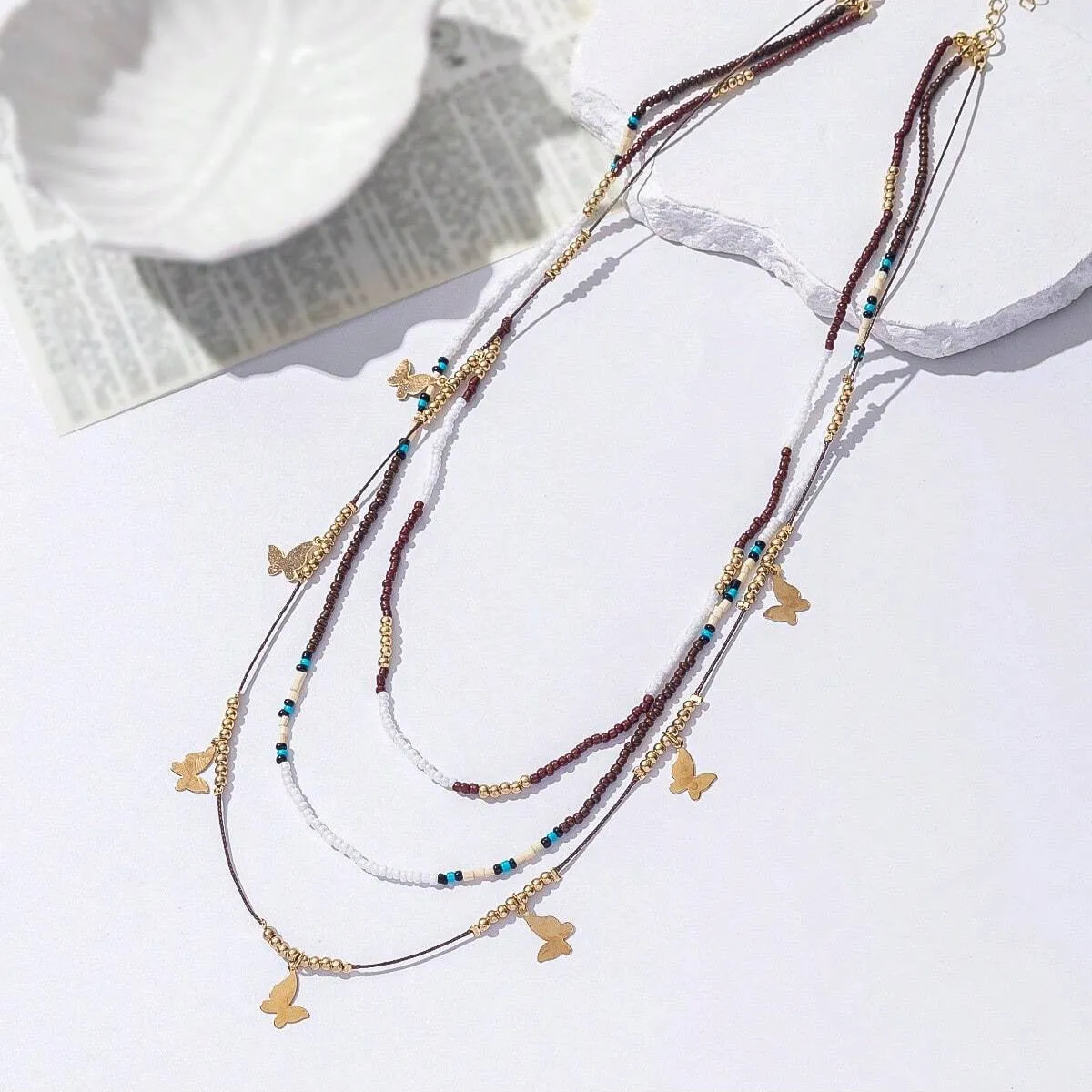 Multi-layer bead necklace with alloy geometric pendant in ethnic style, unisex clavicle chain
