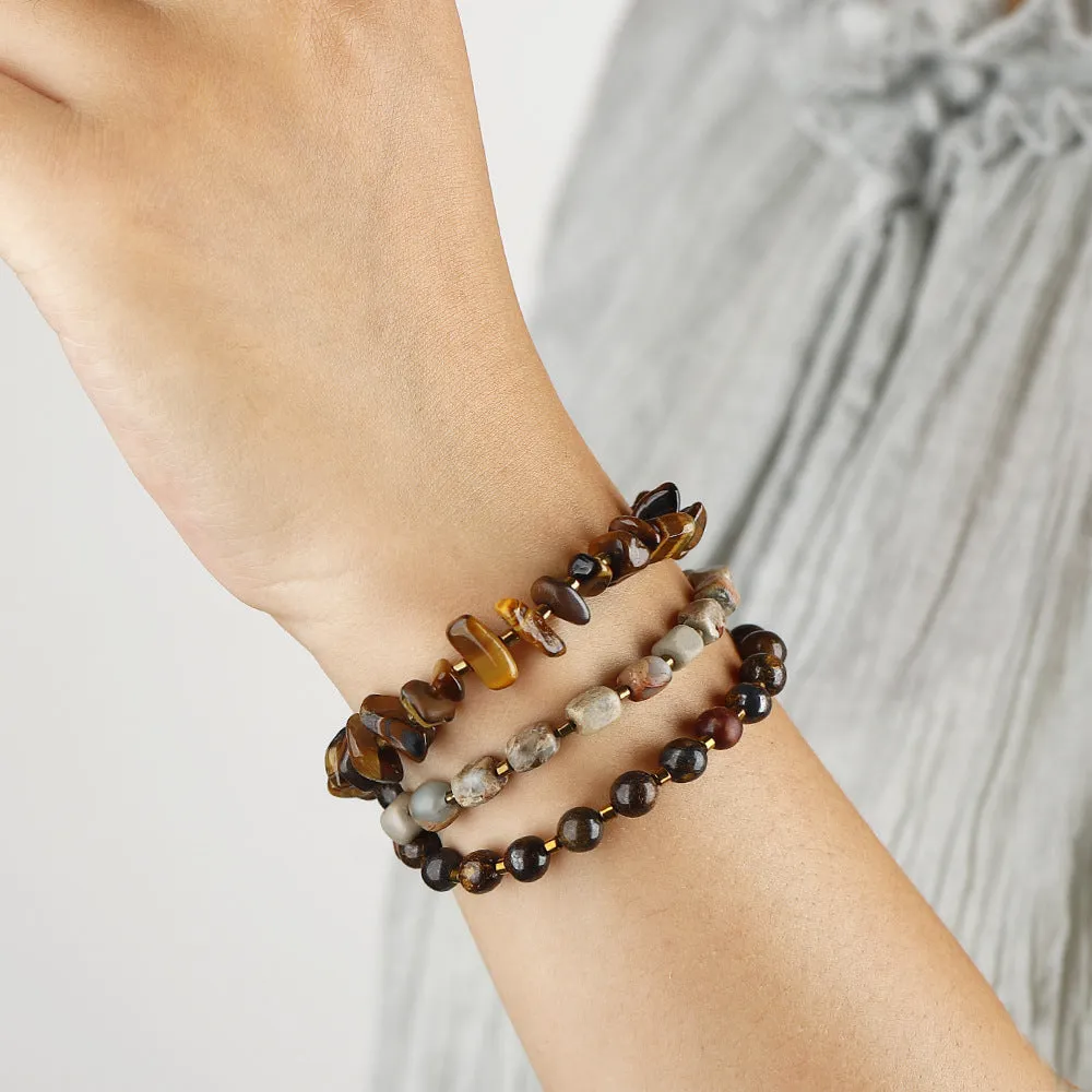 Tigereye stone and bronze geometric bracelet with glow ball design and texture details