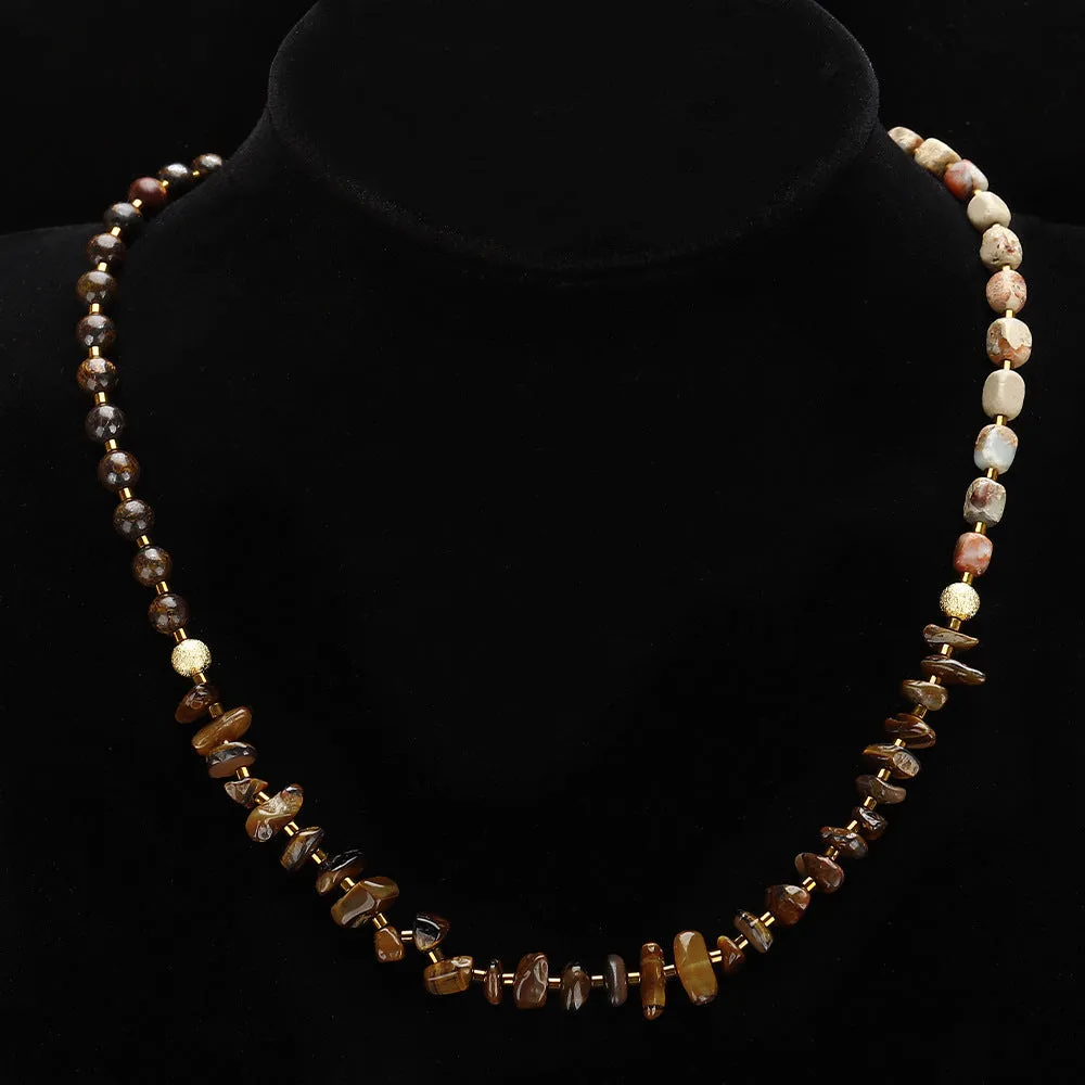 Tigereye stone and bronze geometric bracelet with glow ball design and texture details