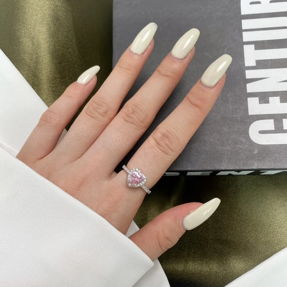 Women's S925 sterling silver heart-shaped ring in white diamond electroplated finish on white background