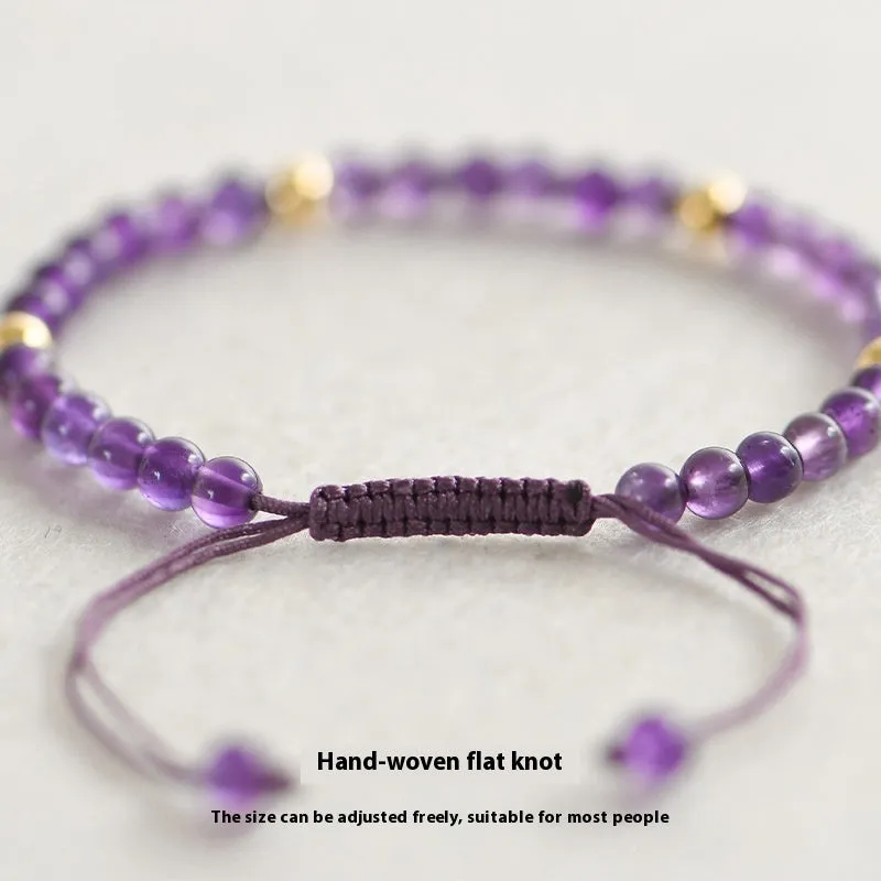 Handmade purple amethyst and 14K gold bracelet with 4mm round beads on a wrist.