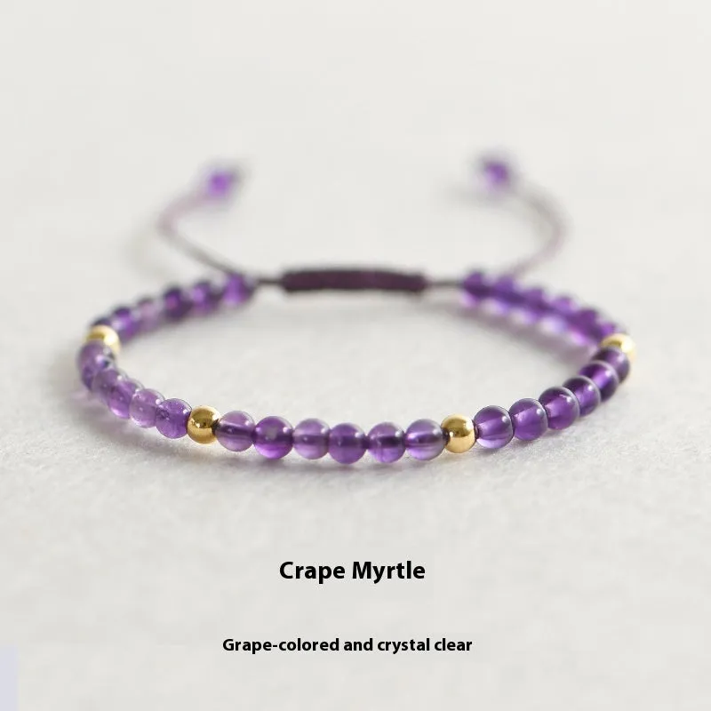 Handmade purple amethyst and 14K gold bracelet with 4mm round beads on a wrist.