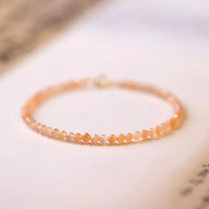 Ultra-thin 3mm sunstone crystal bracelet shown on wrist with natural colour variations