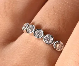 925 silver round moissanite ring with white gold electroplated finish on a geometric band, available in sizes 5 to 9