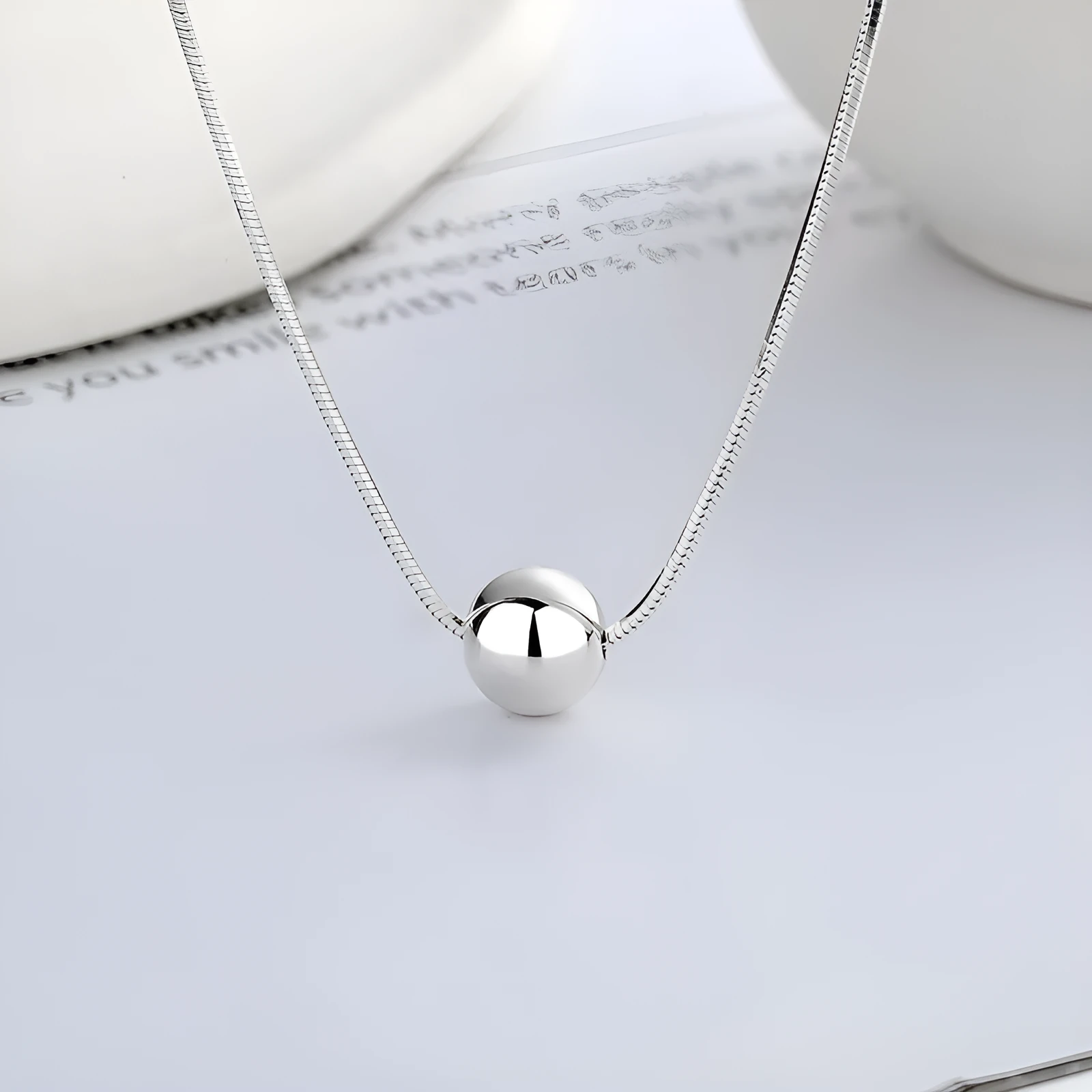 Small ball pendant on delicate 925 silver clavicle necklace with round YFL376 design