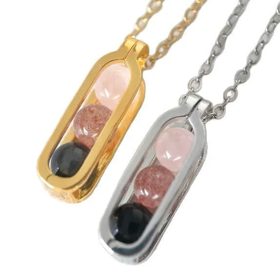 Minority simple pearl necklace with gold titanium steel chain and inlaid pearl pendant on plain background