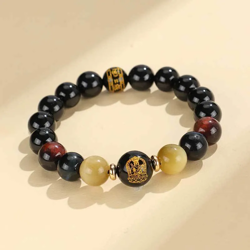 Manually crafted black agate beaded bracelet with gold, blue, and red tiger eye stones, showing ethnic zodiac design.