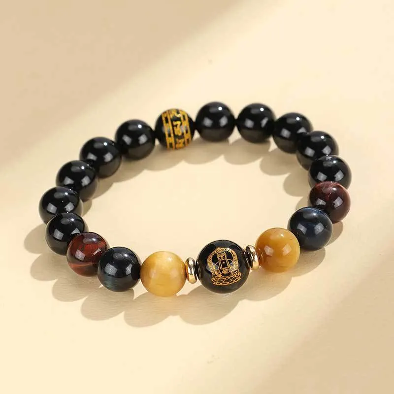 Manually crafted black agate beaded bracelet with gold, blue, and red tiger eye stones, showing ethnic zodiac design.