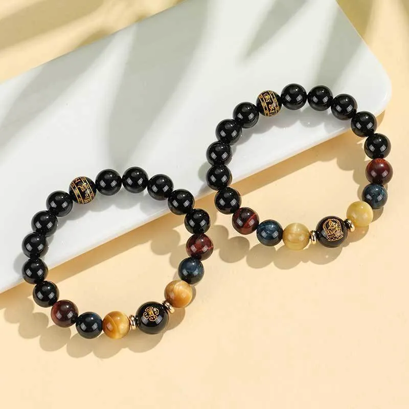 Manually crafted black agate beaded bracelet with gold, blue, and red tiger eye stones, showing ethnic zodiac design.