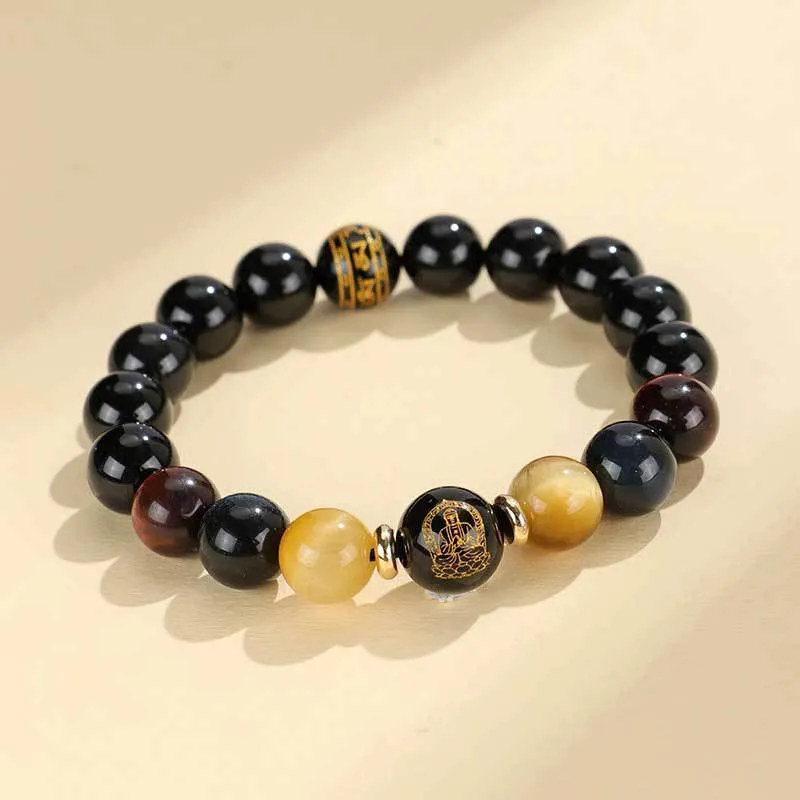 Manually crafted black agate beaded bracelet with gold, blue, and red tiger eye stones, showing ethnic zodiac design.