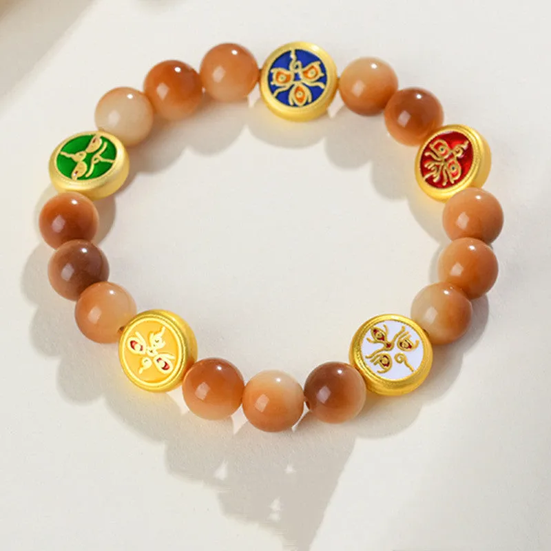 Yellow Bodhi seed bracelet showing five directions geometric design with round beads