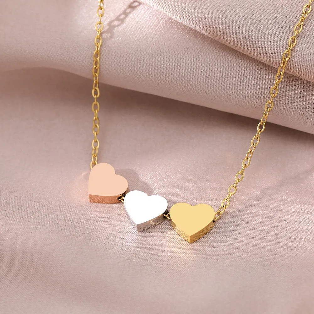 Mirror finish titanium steel heart pendant necklace in gold, rose gold, and steel colour options