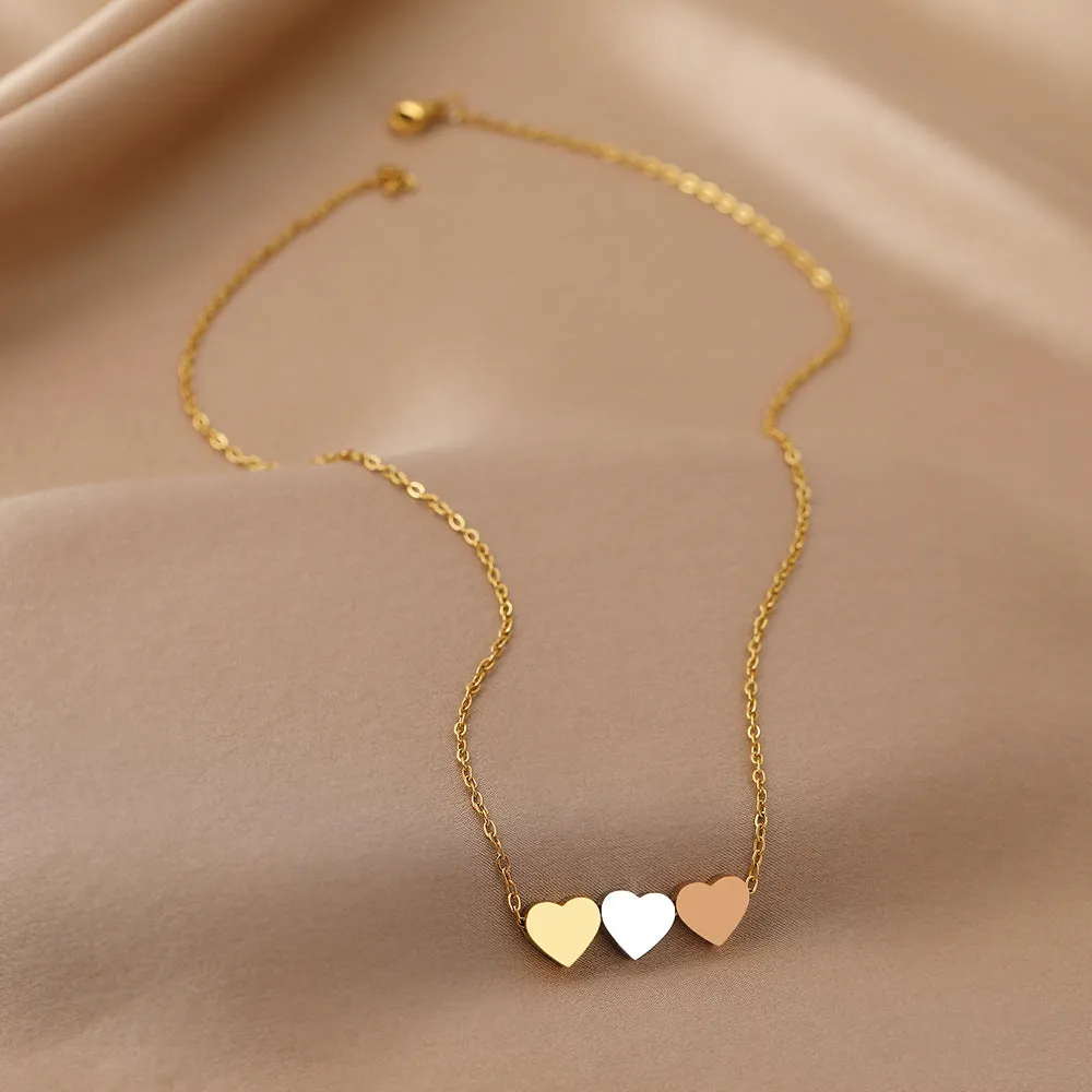 Mirror finish titanium steel heart pendant necklace in gold, rose gold, and steel colour options