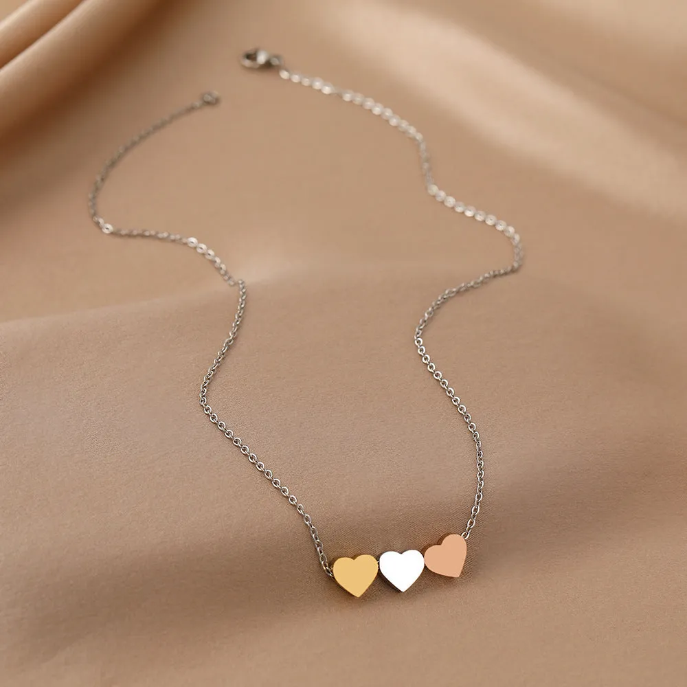 Mirror finish titanium steel heart pendant necklace in gold, rose gold, and steel colour options