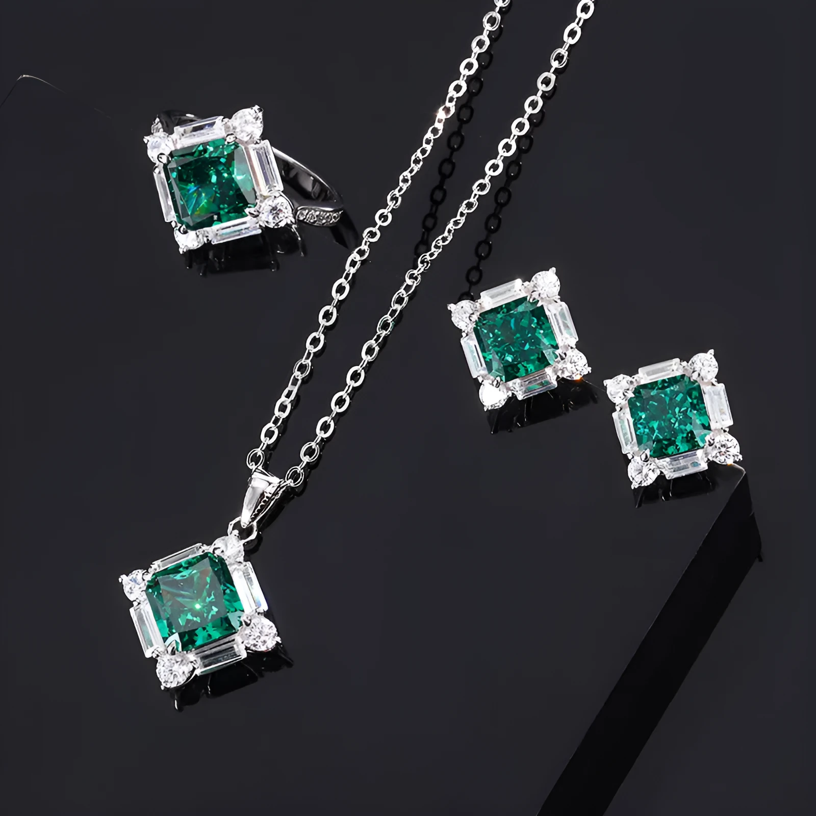 S925 silver emerald diamond jewellery set with necklace earrings and ring on display