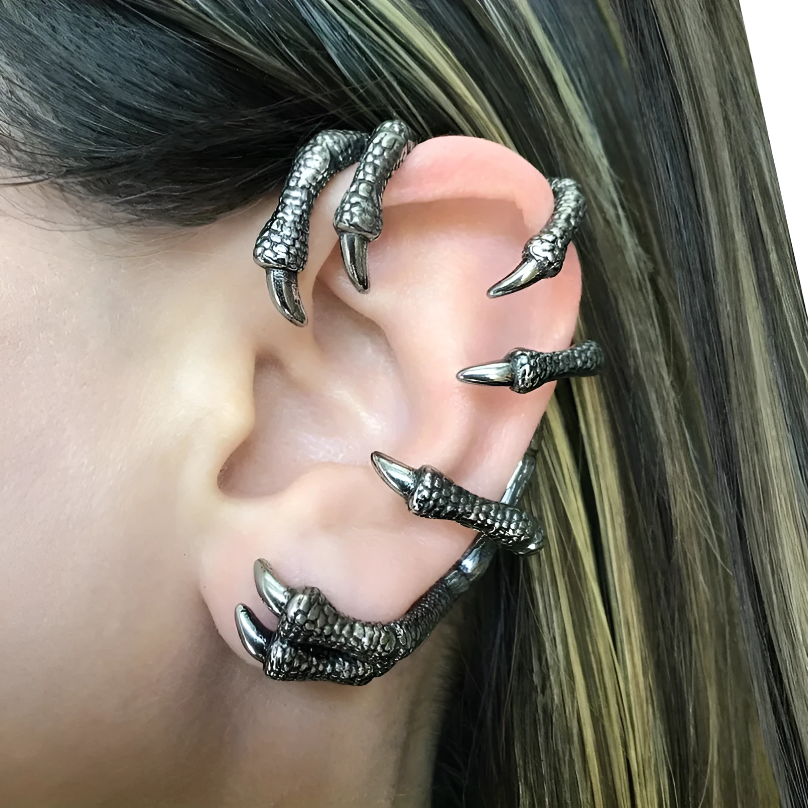 Black copper ear studs with street punk style electroplated finish on a plain background