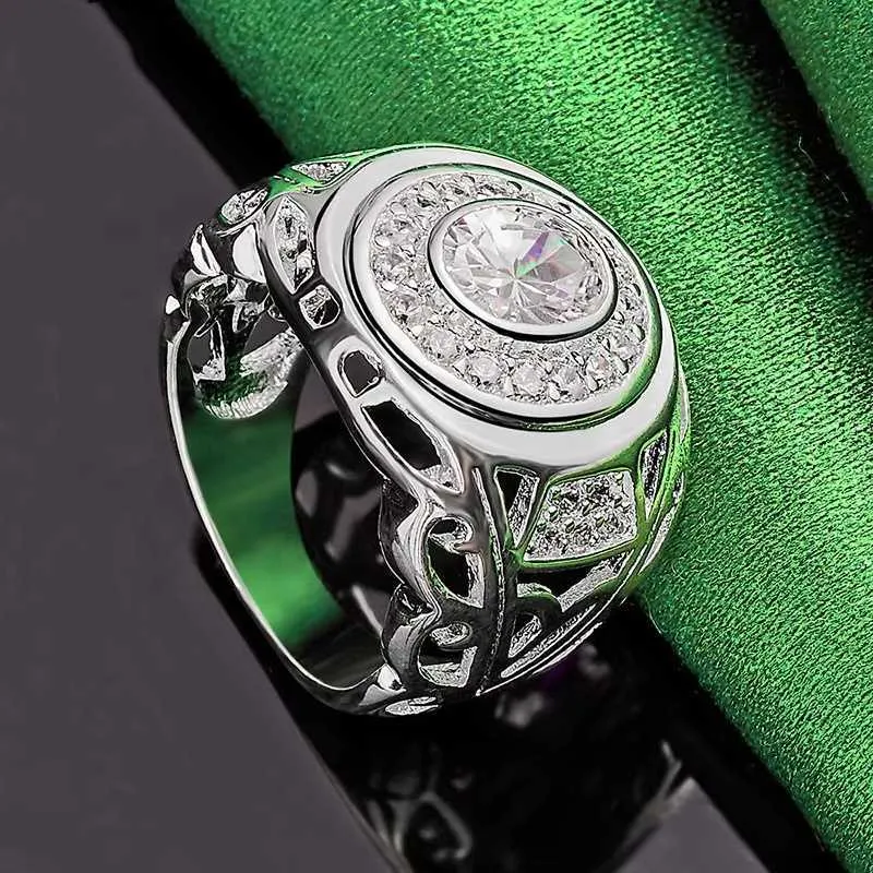 Round zircon silver electroplated copper ring on finger, available in sizes No 6 to No 10