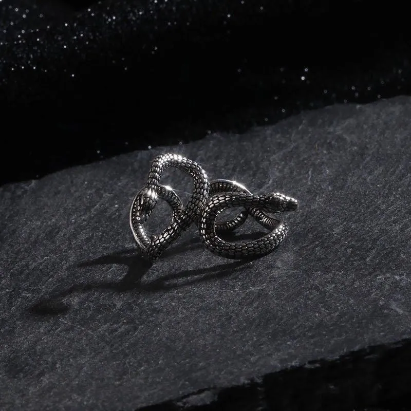 Retro snake-shaped alloy ear clip with electroplated finish on a neutral background