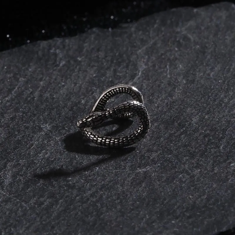 Retro snake-shaped alloy ear clip with electroplated finish on a neutral background