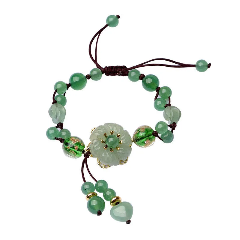 Women's hand-woven bracelet with Chinese auspicious patterns showing flower elements and mixed material texture