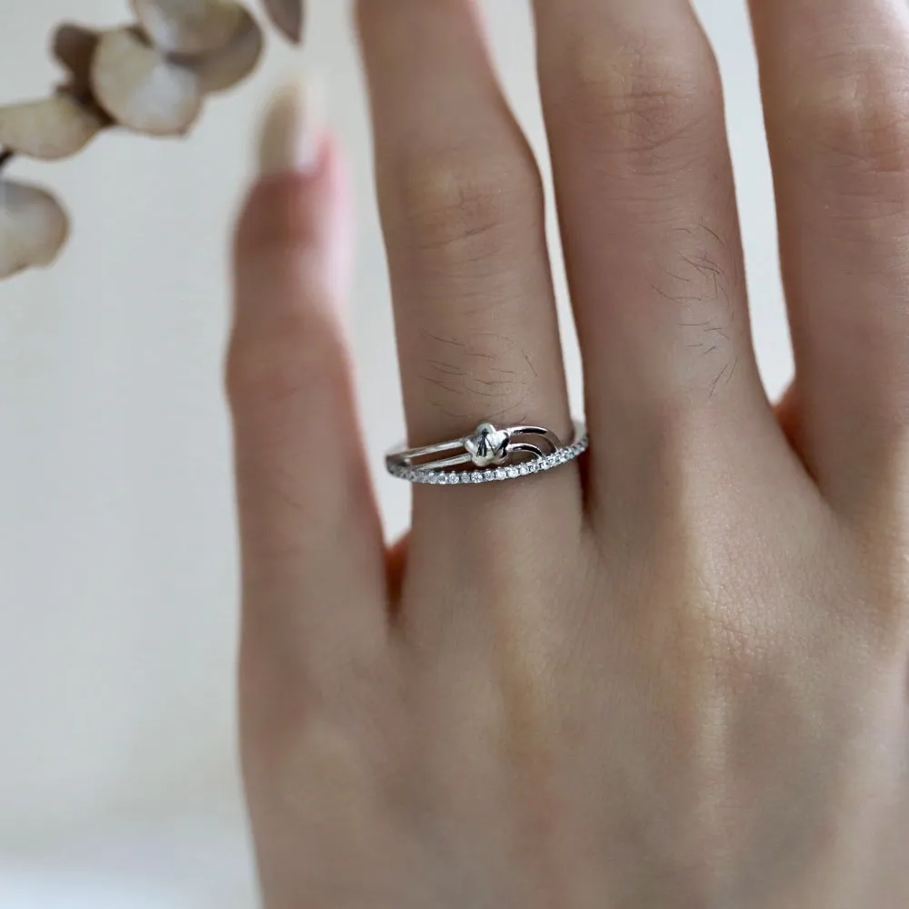 XINGX Korean-style women's S925 silver single-row diamond ring in white gold finish on a white background