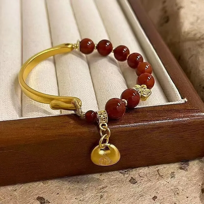 Golden south red agate character ingot women's bracelet with lucky bag design