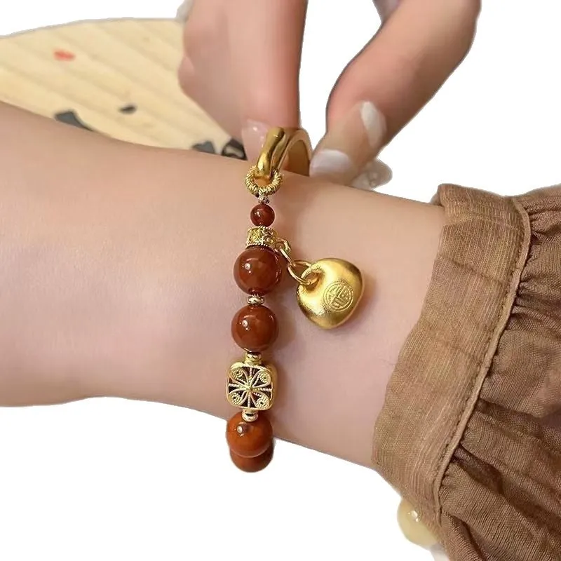 Golden south red agate character ingot women's bracelet with lucky bag design