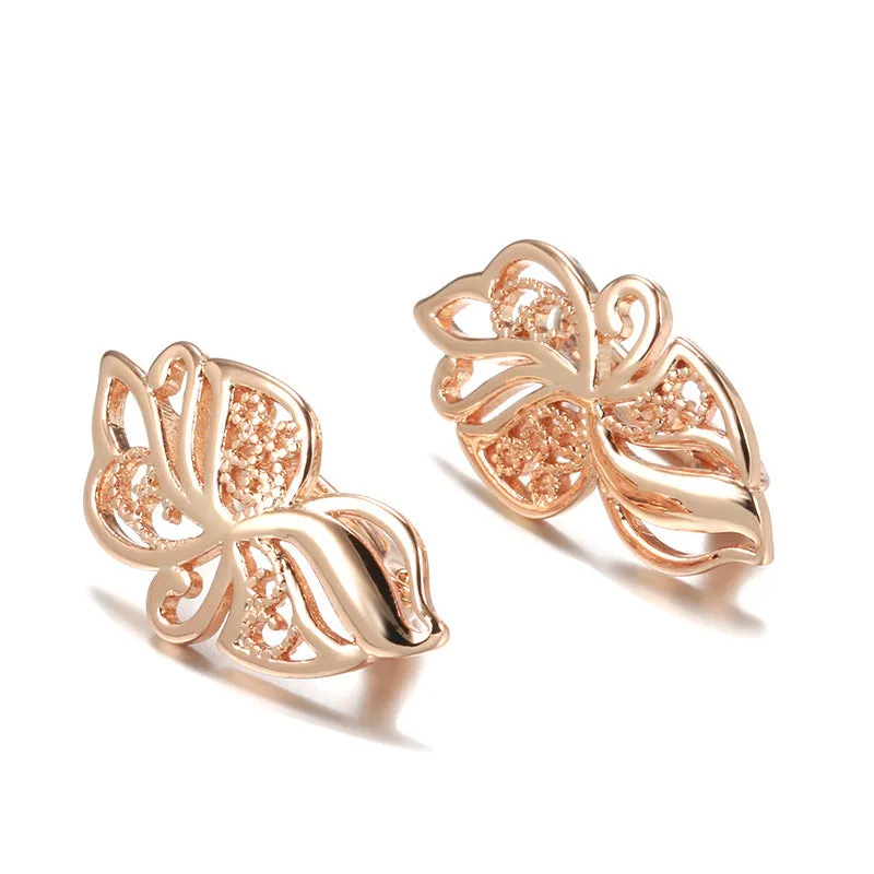 Women's rose gold earrings with hollow carved geometric design and rhinestone accents